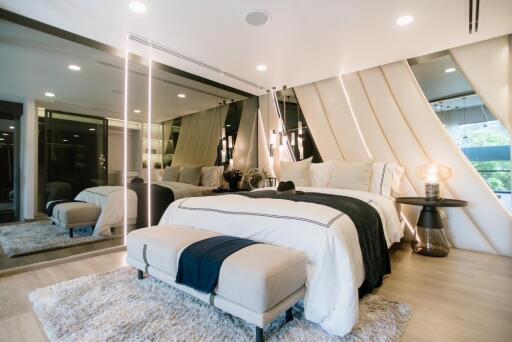 Modern and cozy bedroom with mirrors and elegant decor