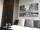 Modern bedroom with cityscape wall art