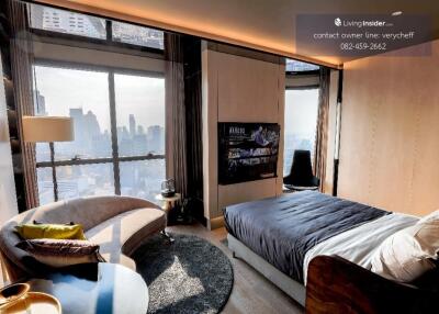 Modern bedroom with large windows and city view