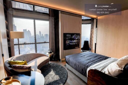 Modern bedroom with large windows and city view