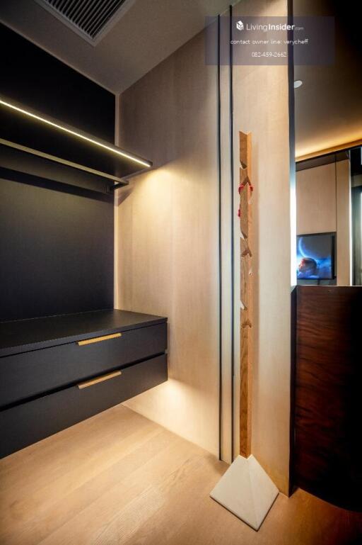 A modern walk-in closet with ample storage and contemporary design.