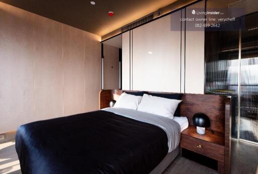 Modern bedroom with large bed and wooden side tables