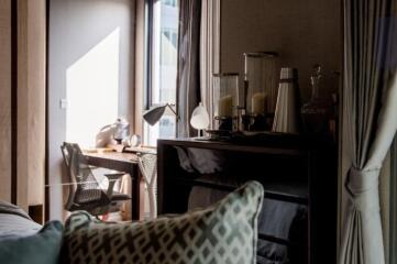 Cozy bedroom with natural light and work desk