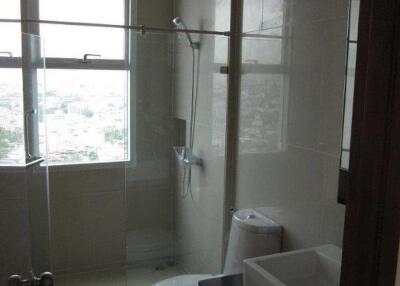 Modern bathroom with glass partition and large windows