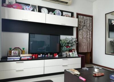 Living room with modern entertainment unit and decor