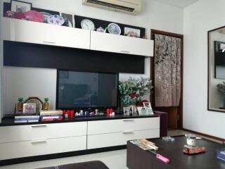 Living room with modern entertainment unit and decor