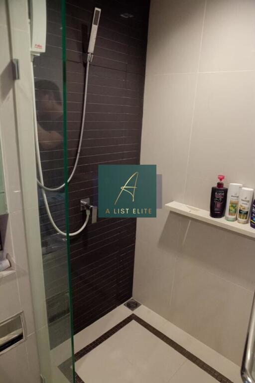 Bathroom with modern shower and toiletries