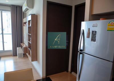 Modern kitchen with refrigerator and shelving