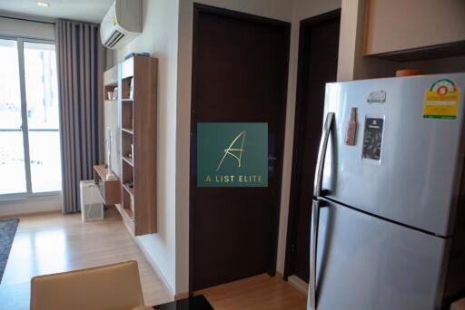 Modern kitchen with refrigerator and shelving