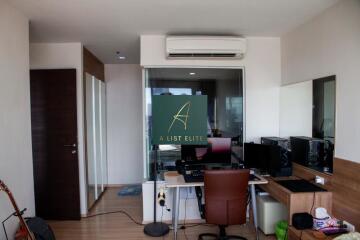 Modern home office with glass partition and work desk