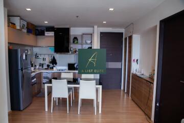 Modern kitchen and dining area with wooden flooring