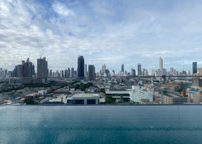 City skyline view with an infinity pool