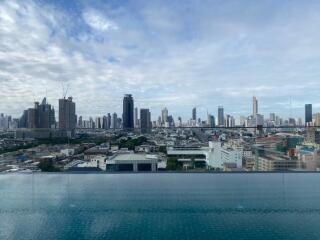 City skyline view with an infinity pool