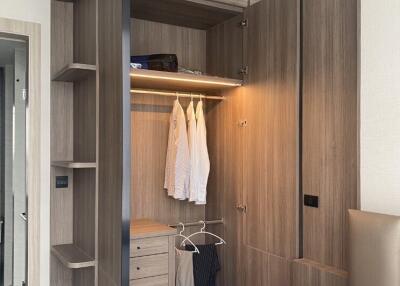 modern bedroom with open wooden wardrobe