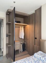 modern bedroom with open wooden wardrobe