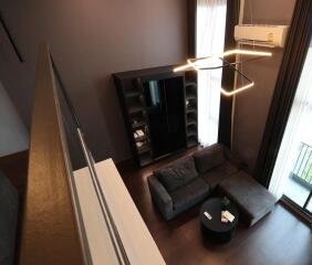 Modern living room with dark furniture