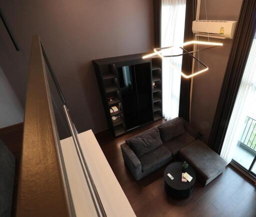 Modern living room with dark furniture