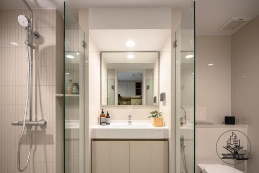 Modern bathroom with shower, sink, and mirror