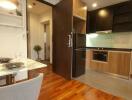 Modern kitchen and dining area with wooden floors and contemporary design