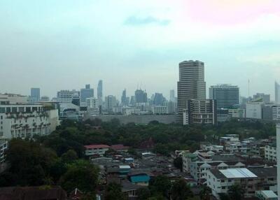 View of a cityscape with buildings and greenery