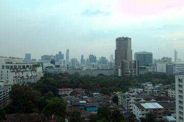 View of a cityscape with buildings and greenery