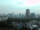 View of a cityscape with buildings and greenery