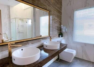 Modern Bathroom with Double Sinks and Large Mirror