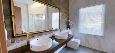 Modern Bathroom with Double Sinks and Large Mirror