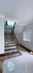 Elegant marble staircase in a bright hallway