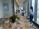 Modern dining area with a large table, window views, and contemporary decor