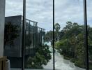 Large windows with a view of a garden and modern architecture