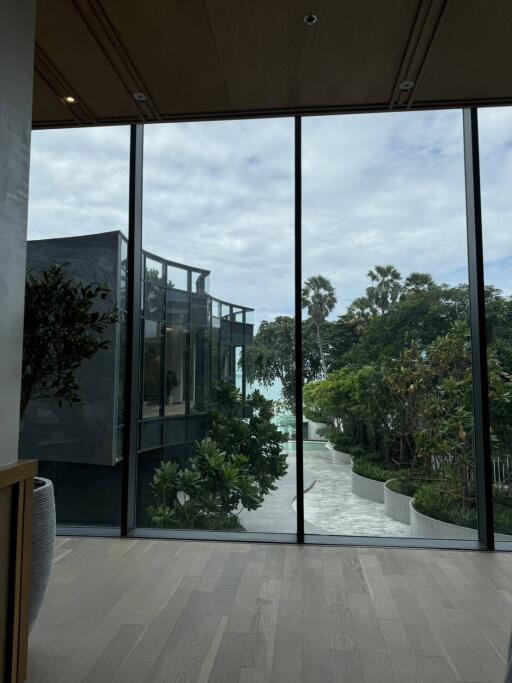 Large windows with a view of a garden and modern architecture