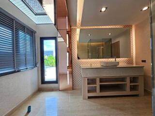 Modern bathroom with large vanity and mirror