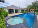 Backyard with swimming pool and outdoor seating