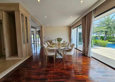 Spacious and well-lit dining room with glass walls