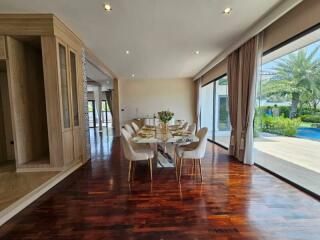 Spacious and well-lit dining room with glass walls