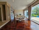 Spacious and well-lit dining room with glass walls