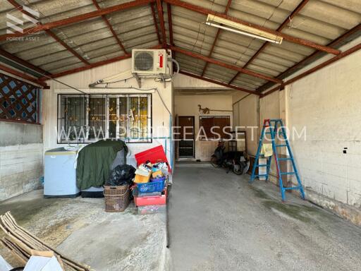 Interior view of a garage with various items and tools