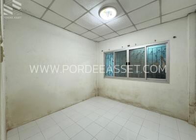 Empty room with tiled floor and window