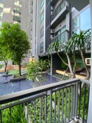 Balcony view of garden with pool