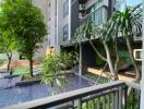 Balcony view of garden with pool