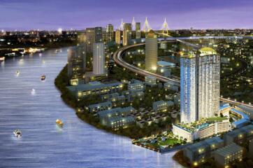 Skyline view featuring high-rise buildings along a river at dusk