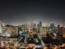 Night view of city skyline with illuminated buildings