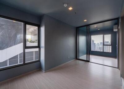 Modern living room with large windows and city view