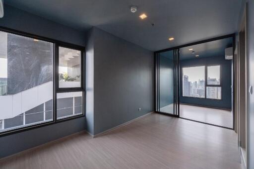 Modern living room with large windows and city view