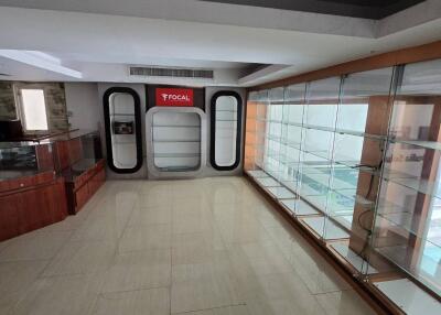 Empty commercial space with display shelves