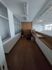 Bright hallway with windows and seating