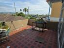 Spacious balcony with tiling and scenic view