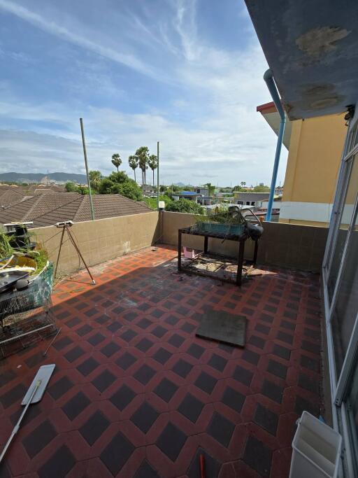 Spacious balcony with tiling and scenic view