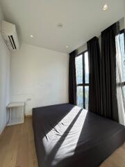 Bedroom with large windows and natural light